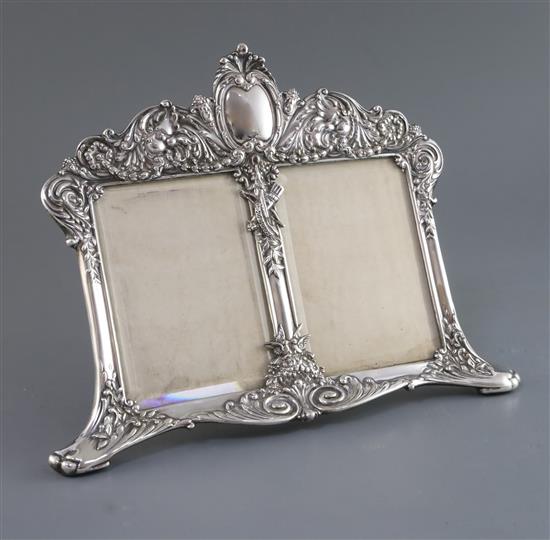 A late 19th/early 20th century Tiffany & Co Art Nouveau sterling silver double photograph frame, width 27.2cm.